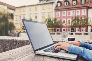 Businesswoman using laptop in cafe