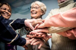 Group of seniors making activities inside the hospice