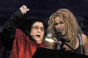 (FILES) Colombian singer Shakira (R) and