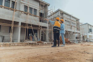 Site manager working with client to inspect site.