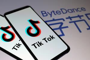 FILE PHOTO: Tik Tok logos are seen on smartphones in front of displayed ByteDance logo in this illustration