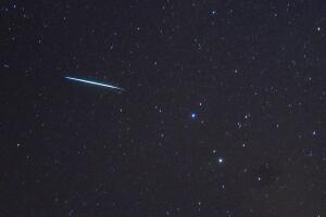 A meteor (L) from the Geminids meteor sh