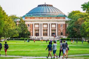 Students walk on university campus quad
