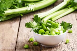 Fresh sliced celery in a white bowl