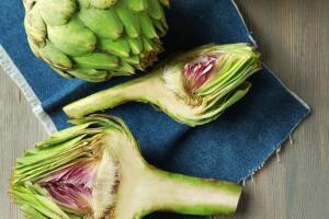 Artichokes on wooden background