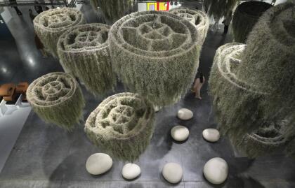An art installation titled "Spanish Moss Sanctuary," by artist Paloma Teppa, is displayed during Art Basel Miami Beach Wednesday, Dec. 4, 2024, in Miami Beach, Fla. (AP Photo/Lynne Sladky)