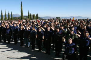 Members of the Falange give the fascist