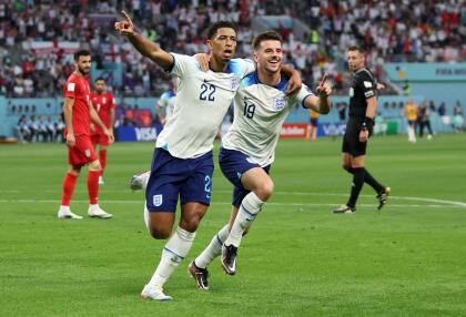 DOHA, QATAR - NOVEMBER 21: Jude Bellingham of England celebrates with Mason Mount after scoring their team's first goal during the FIFA World Cup Qatar 2022 Group B match between England and IR Iran at Khalifa International Stadium on November 21, 2022 in Doha, Qatar. (Photo by Clive Brunskill/Getty Images)