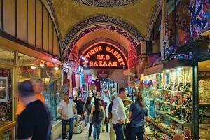 People shopping in the old Bazar in Istanbul, Turkey, antique market old bazaar label.