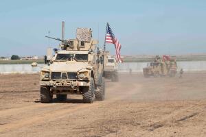 U.S. and Turkish military forces conduct a joint ground patrol in northeast Syria
