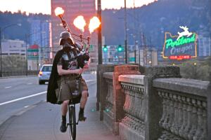 Darth Vader Riding a Unicycle Playing Flaming Bagpipes in Portland