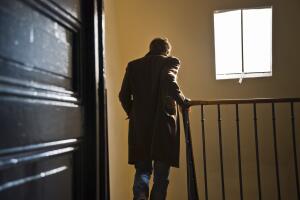 Man leaves home and goes downstairs 