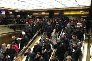 Commuters exit the New York Port Authority in New York City after reports of an explosion