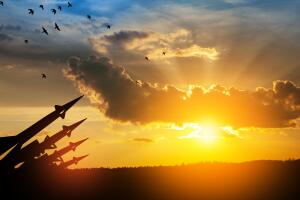 The missiles are aimed at the sky at sunset. Nuclear bomb, chemical weapons, missile defense.