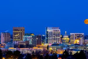 Blue night sky over Boise Idaho with moon