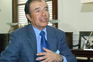 Ex Argentinean President, Carlos Menem, speaks wit