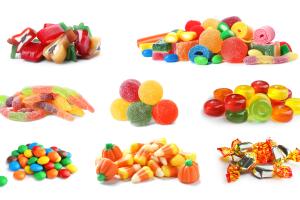 Set of different tasty candies on white background