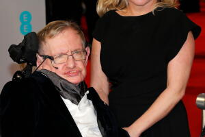 FILE PHOTO: Theoretical physicist Stephen Hawking and his daughter Lucy arrive at the British Academy of Film and Arts (BAFTA) awards ceremony at the Royal Opera House in London