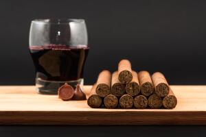 Worldwide famous hand rolled Cuban cigars with Red Wine