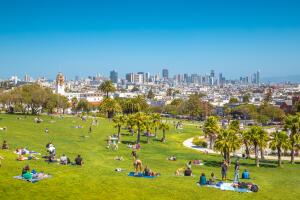 People enjoying sunny weather in Mission Dolores Park, San Francisco, USA