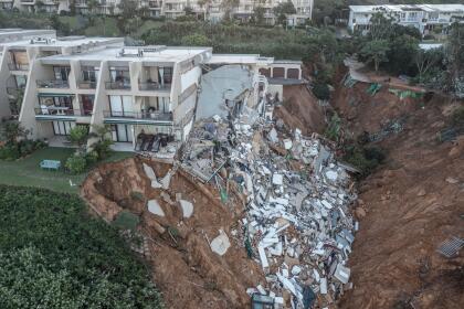 This aerial view shows the destruction at Umdloti beach north of Durban, on April 14, 2022. - Victims of South Africa's deadliest storm on record scrambled to get help on April 14, 2022 as relief teams struggled to cross bridges and roads wrecked by floods and landslides. At least 341 people died when the heaviest rainfall in six decades swept away homes and destroyed infrastructure in the city of Durban and KwaZulu-Natal province. (Photo by MARCO LONGARI / AFP) (Photo by MARCO LONGARI/AFP via Getty Images)