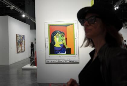 A painting titled "Portrait de Dora Maar," by artist Tom Sachs, is displayed during Art Basel Miami Beach Wednesday, Dec. 4, 2024, in Miami Beach, Fla. (AP Photo/Lynne Sladky)