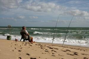 A fisherman watches his lines 25 March,