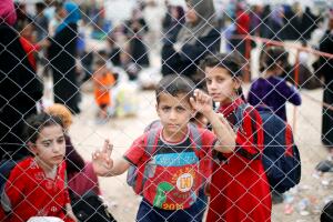 Displaced Iraqis who had fled their homes are seen at Hammam al-Alil camp south of Mosul
