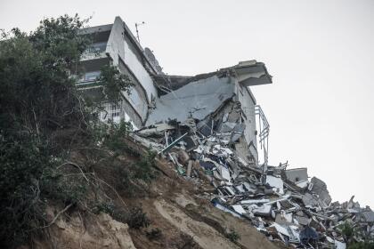 A general view of the destruction at Umdloti beach north of Durban, on April 14, 2022. - Victims of South Africa's deadliest storm on record scrambled to get help on April 14, 2022 as relief teams struggled to cross bridges and roads wrecked by floods and landslides. At least 341 people died when the heaviest rainfall in six decades swept away homes and destroyed infrastructure in the city of Durban and KwaZulu-Natal province. (Photo by MARCO LONGARI / AFP) (Photo by MARCO LONGARI/AFP via Getty Images)