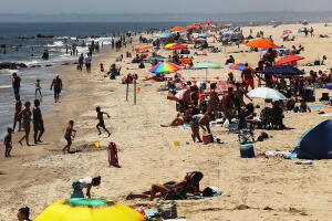 New Yorkers Beat The Heat At City Beaches One Day After The Independence Holiday