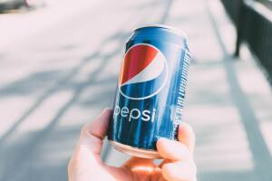 person_holding_pepsi_can_stock.jpeg