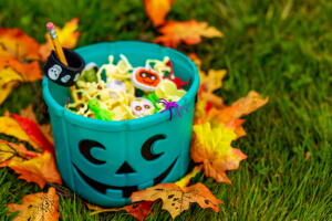Halloween teal basket full of non-food treats