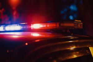 Close-up Shot of Police Car Siren Lights. Offices of the Law Ready for Action, Chase the Criminals, Arrest Offenders and Fight Crime. Stylish Cinematic Lights with Dark Sky