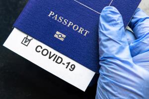 COVID-19 coronavirus pandemic and travel concept, COVID-19 note in passport. Novel corona virus outbreak, spread of epidemic from China.