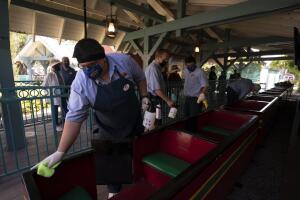 Virus Outbreak Theme Park Reopens Photo Gallery
