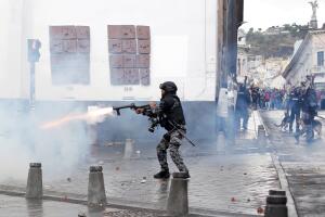 Riot police clash with demonstrators during protests after Ecuador's President Lenin Moreno's government ended four-decade-old fuel subsidies, in Quito