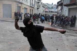 Demonstrators clash with riot police during protests after Ecuador's President Lenin Moreno's government ended four-decade-old fuel subsidies, in Quito