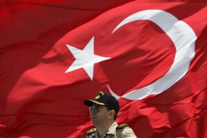 A Turkish army officer stands in front o
