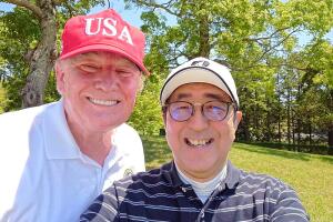 Japan's Prime Minister Shinzo Abe poses for a selfie with U.S. President Donald Trump at Mobara Country Club in Mobara