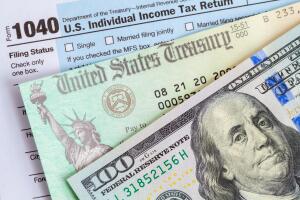 Money with Tax Check and Form 1040