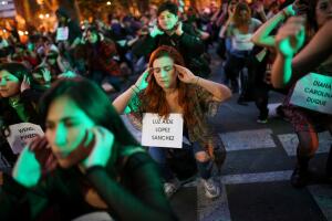A feminist collective wearing the names of victims of femicide sing the song "a rapist on the road", a song that became famous this week in Chile, during a protest in Bogota