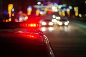 police car lights in night city with selective focus and bokeh