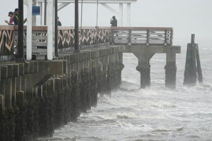 Waves crash along the Ballast Point Pier ahead of Hurricane Ian, Wednesday, Sept. 28, 2022, in Tampa, Fla. The U.S. National Hurricane Center says Ian's most damaging winds have begun hitting Florida's southwest coast as the storm approaches landfall. (AP Photo/Chris O'Meara)