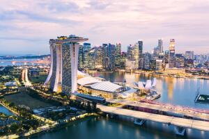 View from above, stunning aerial view of the skyline of Singapore during a beautiful sunset with the financial district in the distance. Singapore.
