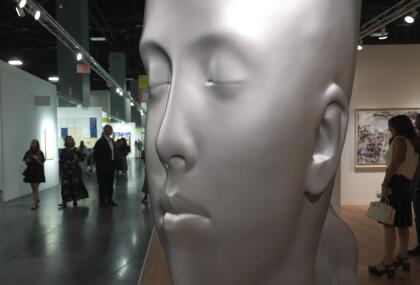 A stainless steel sculpture titled "Juana," by artist Jaume Plensa, is displayed during Art Basel Miami Beach Wednesday, Dec. 4, 2024, in Miami Beach, Fla. (AP Photo/Lynne Sladky)