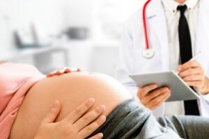 Pregnant Woman and Gynecologist Doctor at Hospital