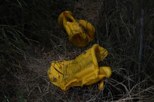 Discarded life-vests are seen by a migrant crossing on the Rio Grande near Mission