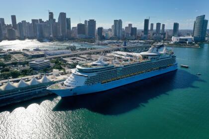 MIAMI, FLORIDA - DECEMBER 31: In an aerial view, a cruise ship waits for people to embark before leaving PortMiami on December 31, 2021 in Miami, Florida. The U.S. Centers for Disease Control and Prevention on Thursday advised people against going on cruises regardless of their vaccination status due to a recent sure in people being diagnosed with COVID-1. (Photo by Joe Raedle/Getty Images)