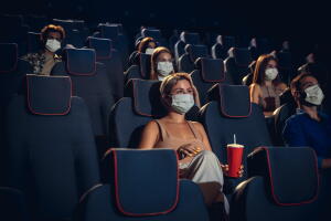 Cinema, movie theatre during quarantine. Coronavirus pandemic safety rules, social distance during movie watching