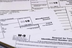 Shot of IRS tax forms 1099-M, 1099-K and W-9